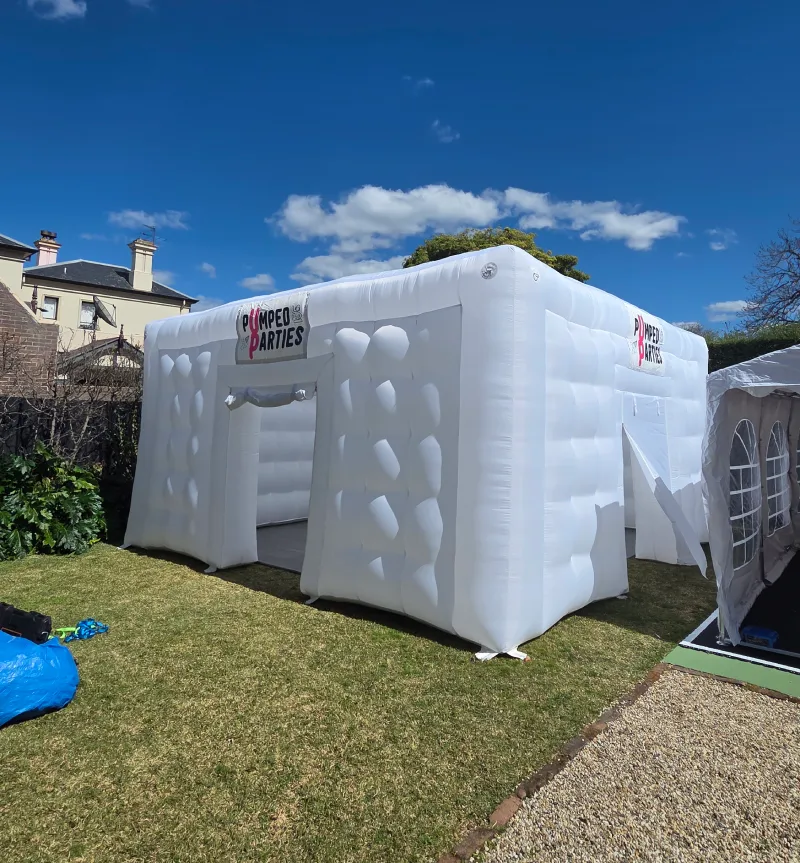 White inflatable tent in a backyard