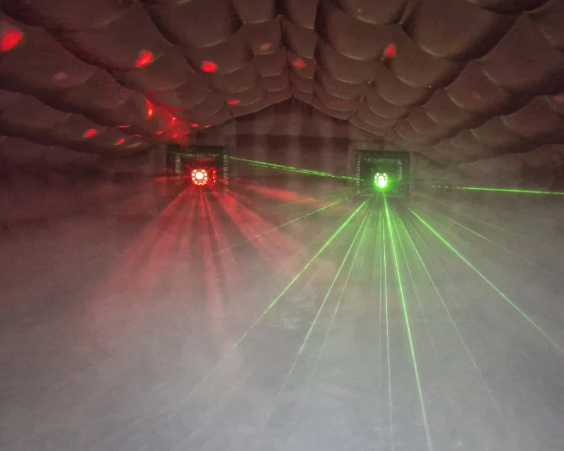 Colourful laser lights inside the black party room
